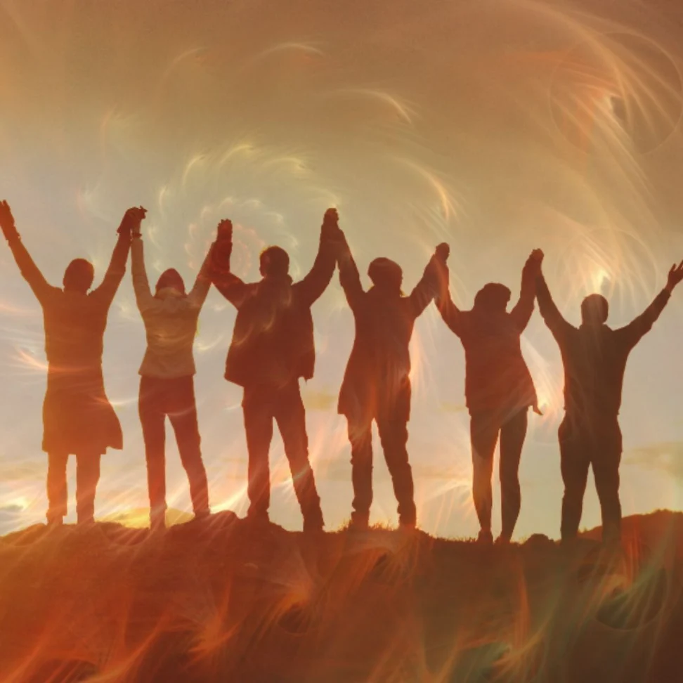 Team Members together holding hands up