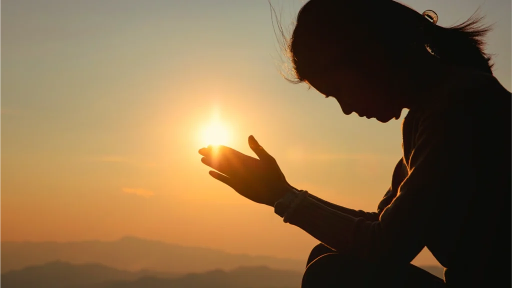 a woman praying to break the chain of fear