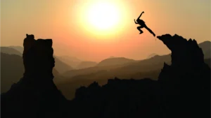 fearless man jumping to a hill
