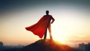 man wearing a red cape symbolizing that humanity can transform fear