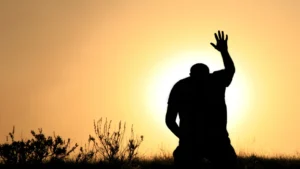 man bowing to the sun like asking the presence of god