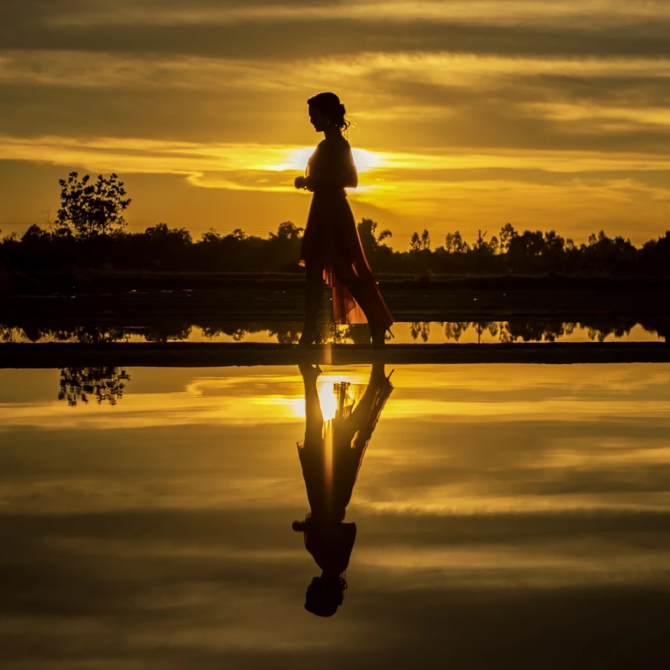 Woman Walking into the Shore